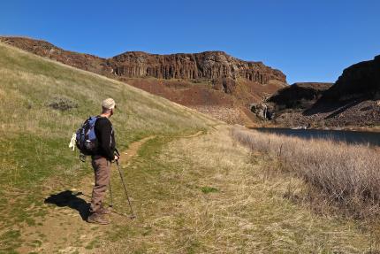 Hiker on a trail at Ancient Dusty Lake