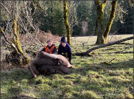 A youth hunter with his first elk harvest