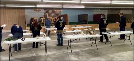 FFA students attempting to identify fish, wildlife, and plant specimens.