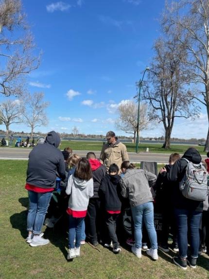 Jahns and Manderbach teaching kids outdoors.