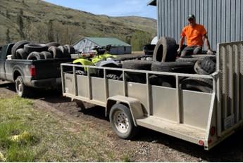 Tires loaded up into a trailer.