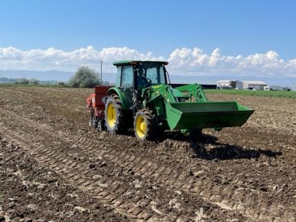 A tractor on a field.