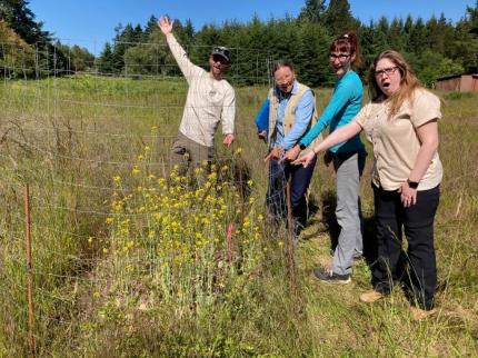 Excited field crew celebrates a newly occupied CCAA site. 