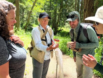 WDFW and Lummi Nation Biologists revel in the first duskywing capture of the survey.