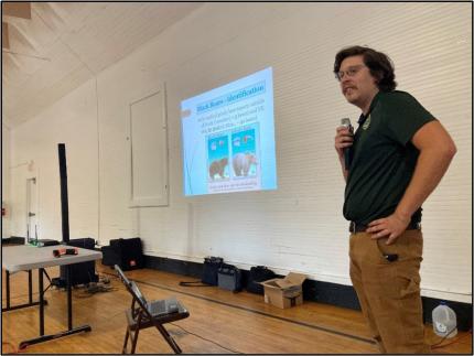 Conflict Technician Kolenberg discussing bear identification.