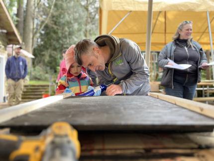 dad and daughter building bat houses