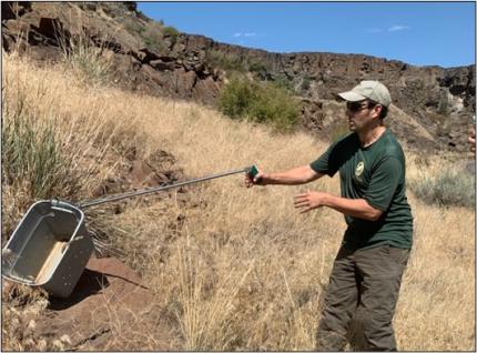 Gallie releasing a rattlesnake