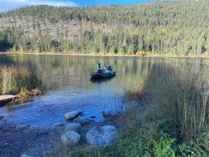 Fish Biologist Osborne and Brant applying rotenone to Williams Lake in Stevens County.  