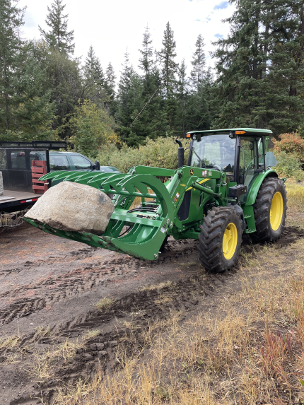 A barrier rock being transported at Shadow Creek gate