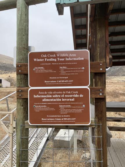 Signs posted on a fence