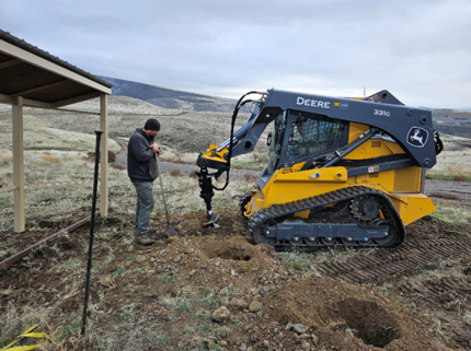 Kiosk holes being augured.