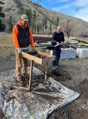 Tritt assisting Archeologist Davis with shovel probes for the cultural resources survey.