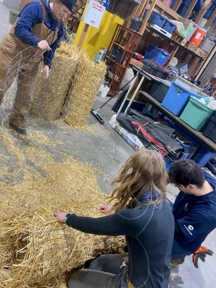 Washington Conservation Corps crew members assisting with constructing hen mallard nest tubes.