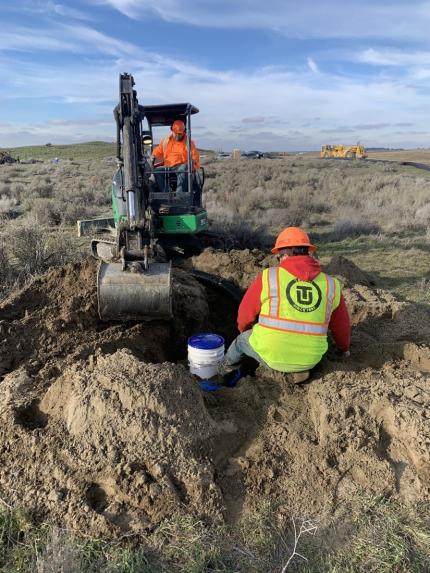 Contractors installing artificial burrows.