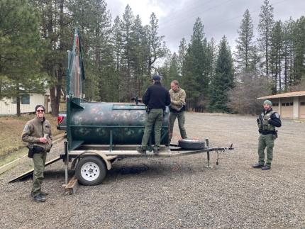 Detachment 53 officers reviewing the new bear trap.