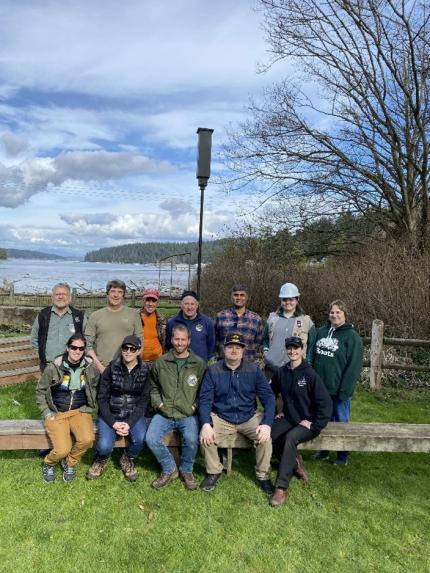 Bat box install team standing proud in front of their hard work.