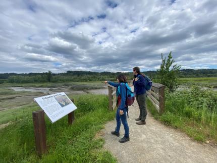  Education Coordinator Althauser and Watchable Wildlife Coordinator Hansen visit the trails at the Theler Wetlands 