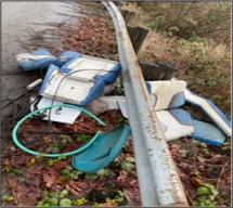 Trash near guard rail